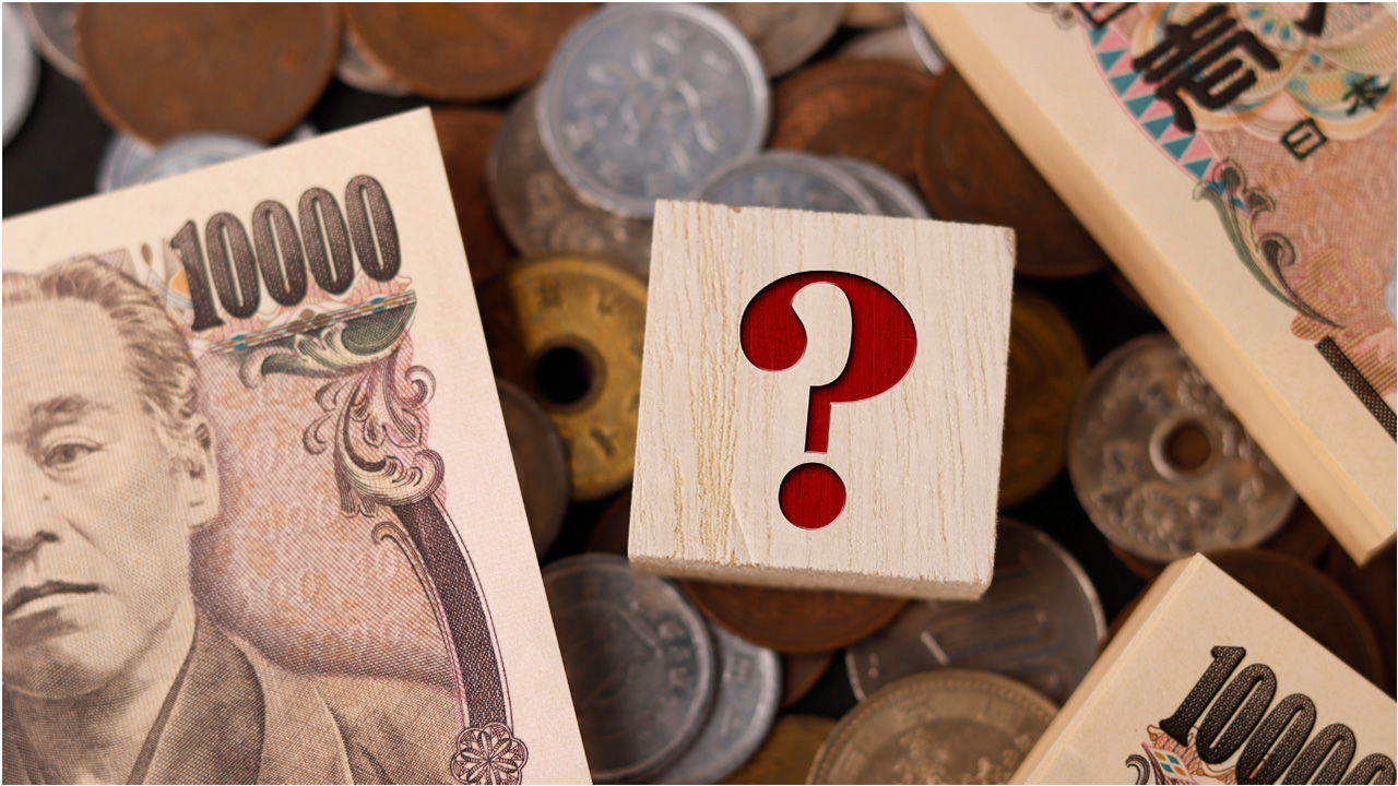 お金とクエスチョンマークの画像